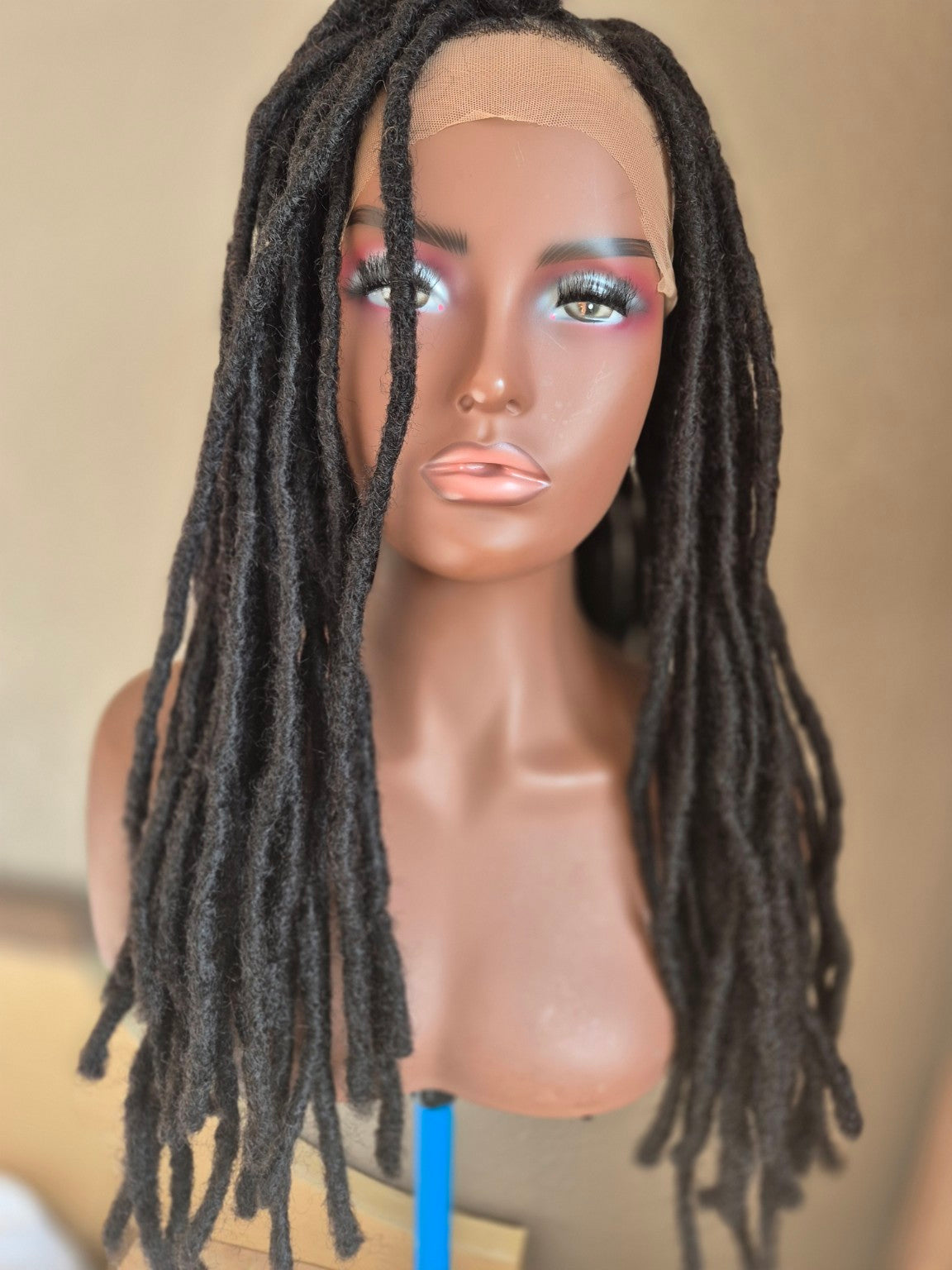 Long dark loc Crown, alternate front view with locs arranged forward