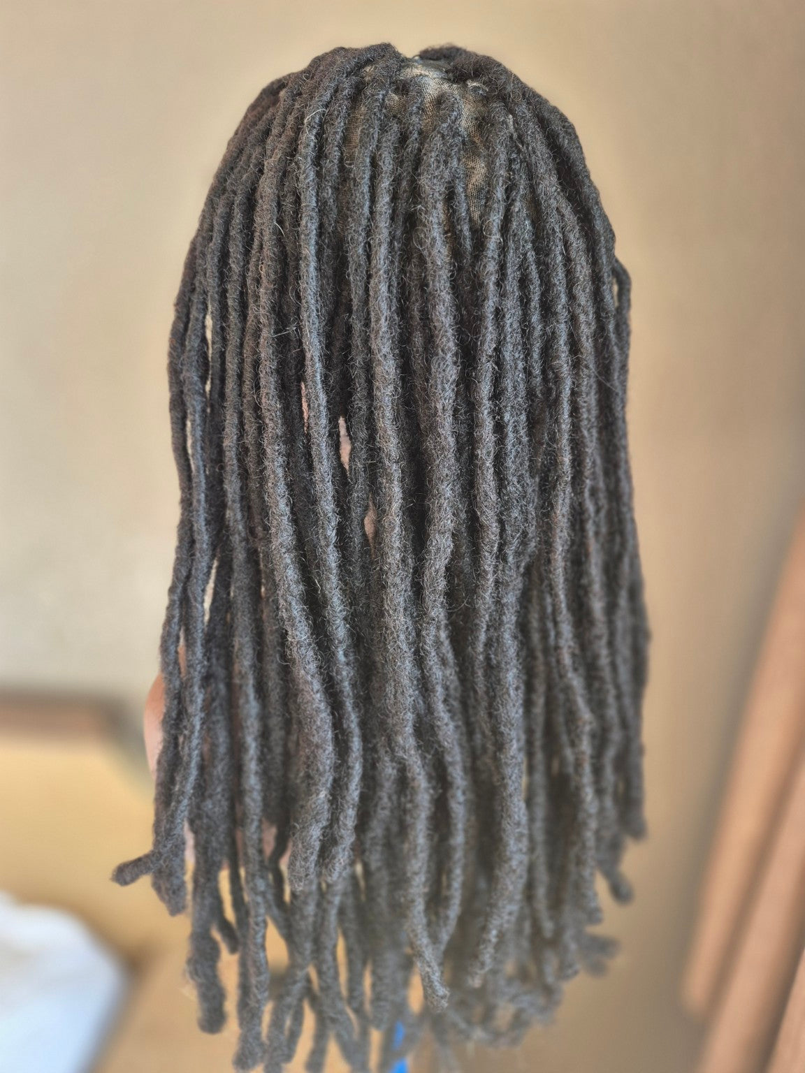 Back view of long dark loc Crown