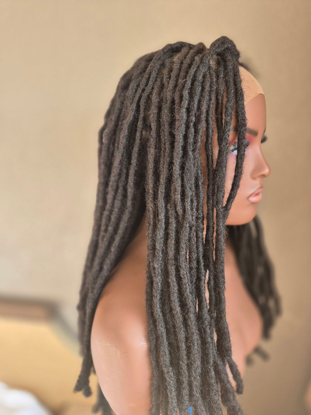Long dark loc Crown from the side
