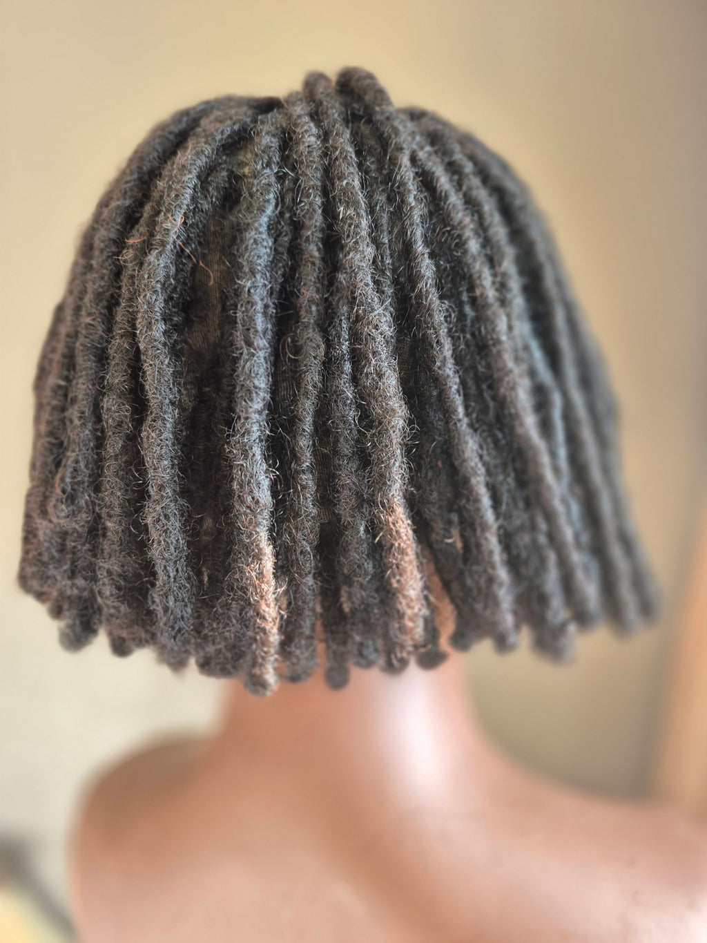 Back of short black loc bob