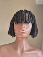 Short black loc bob with fringe, front view on mannequin