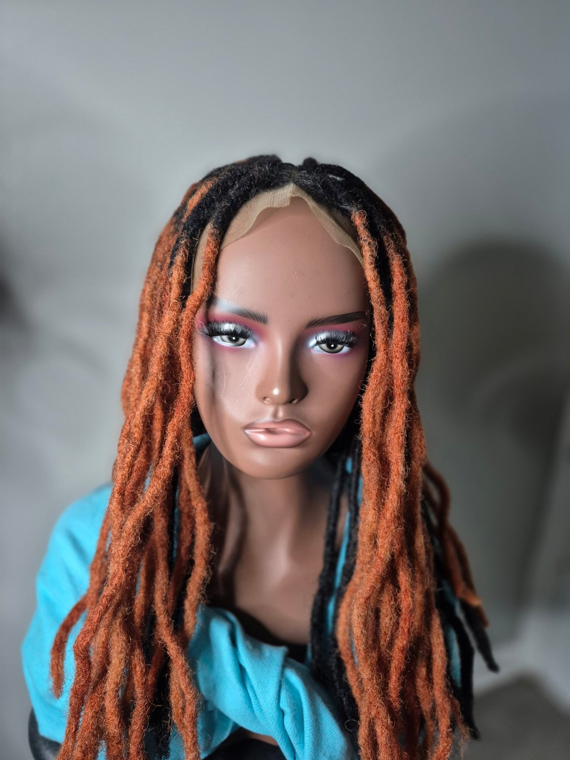Black and copper long loc Crown, front view