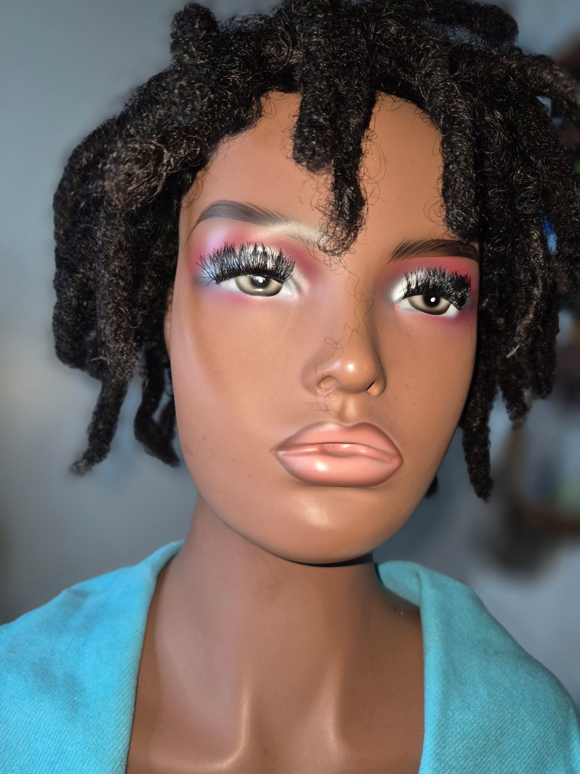 Short black textured loc Crown, sharp close-up