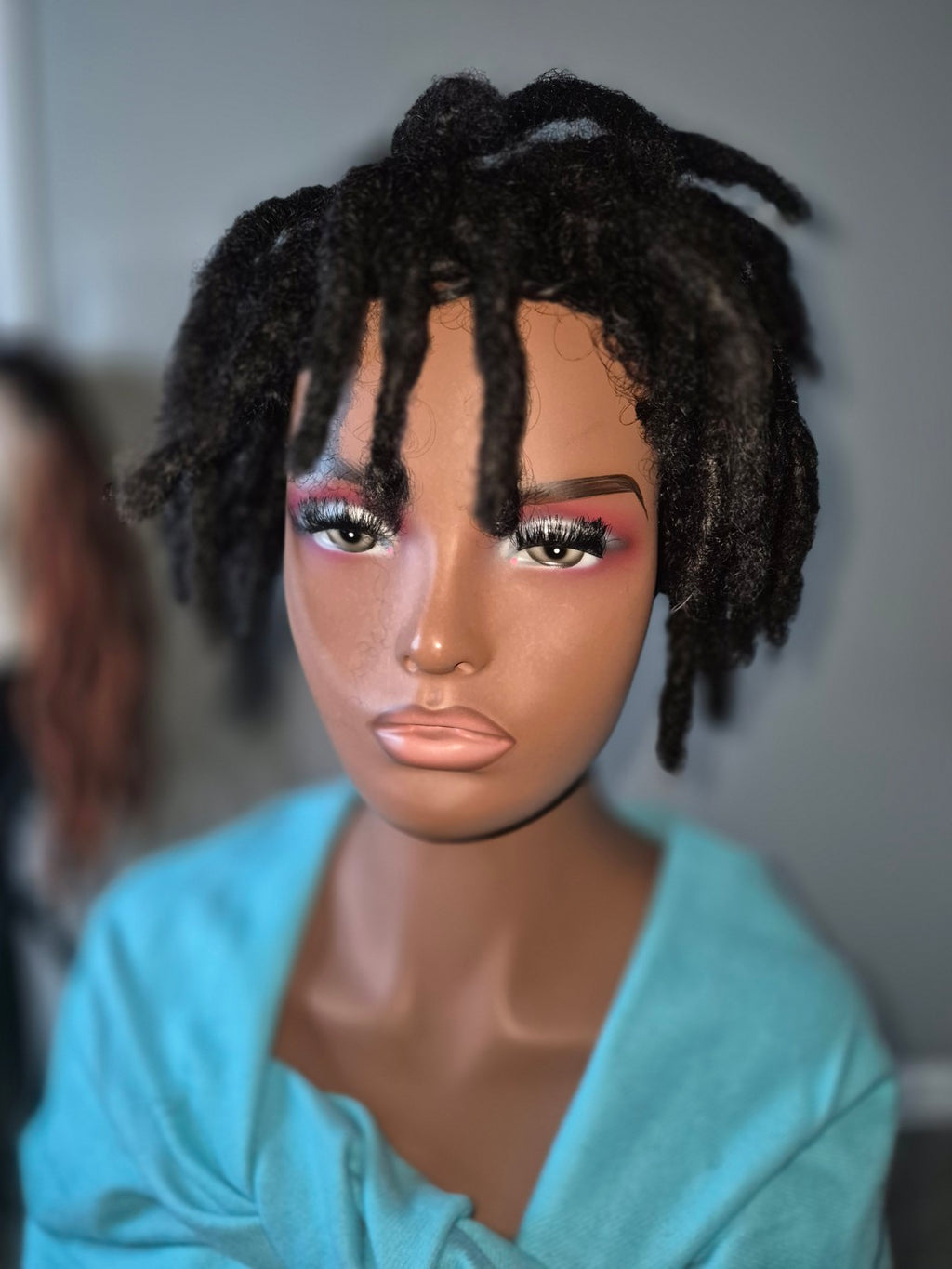 Short black textured loc Crown, full front view